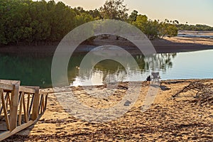 Fisherman`s Chair, Rod And Line On A Creek Bank