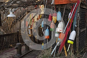 Fisherman`s house with floats and buoys.  USA. Maine.