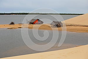 Fisherman`s huts near the lake. In the background vegetation. Northeast region of Brazil, Atins, MaranhÃ£o