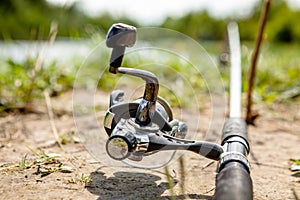 Fisherman`s reel, mounted on a fishing rod. Feeder fishing in English style