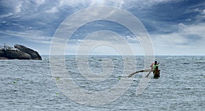 Fisherman sailing on a boat.