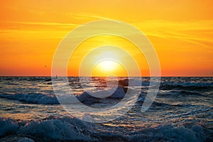 Fisherman sailing with his boat on beautiful sunrise over the sea