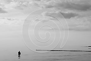 Fisherman, silence in black and white