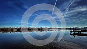 Fisherman sitting on the lake