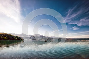 Fisherman in a small boat on a beautiful pristine Alaskan Lake during summer