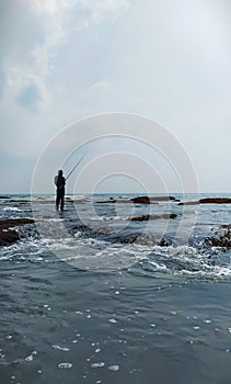 Fisherman Still Waiting For A Fish