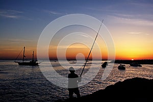 Fisherman by sunset