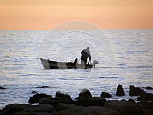 Fisherman on sunset