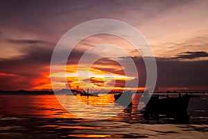 Fisherman in sunset background