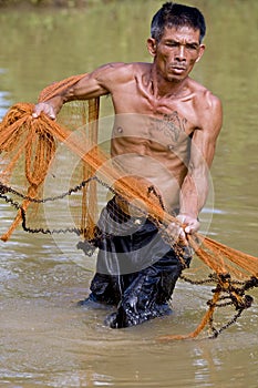 Fisherman of Thailand with throw net