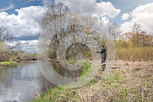 Fisherman throws a spinning rod