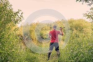 Fisherman throws a spinning view from the back