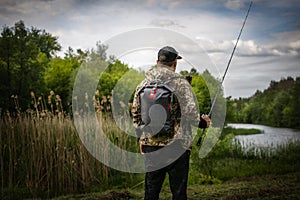 Fisherman and trophy Bass fish.