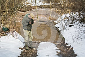 Fisherman try to catch fish in the river.