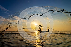 Fisherman use net catch the fish in the sea