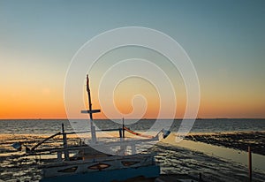 Fisherman vessel in the beach with twilight background stock image