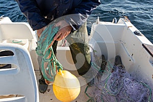 Fisherman winding a rope