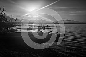 Fisherman wooden boats over bang phra reservoir at sunrise