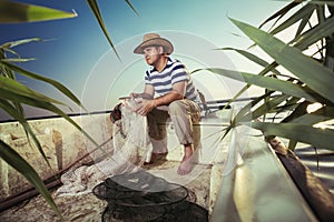 Fisherman at work, cleaning the nets