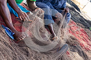 Fishermans mending nets. Burgundy, black, white, gray