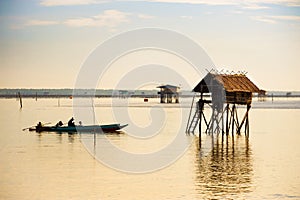 A fishermans sail his boat