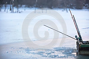 Fishermanâ€™s boat on frozen lake on winter