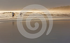 Fishermen in bali beach during sunset