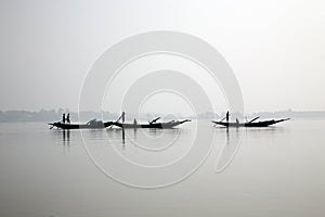 Fishermen on a boat in Sundarbans, India