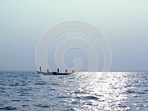 Fishermen boating on fresh morning background