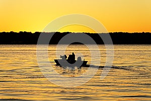 Fishermen Boating into a Golden Sunrise