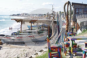 Fishermen boats and outdoor beach restaurant