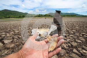 Fishermen can`t fish because of drought. at Land with dry and cracked ground