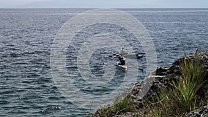 Fishermen catch fish in water of South China Sea in Republic of Philippines.