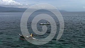 Fishermen catch fish in water of South China Sea in Republic of Philippines.