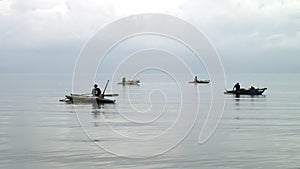 Fishermen catch fish in water of South China Sea in Republic of Philippines.