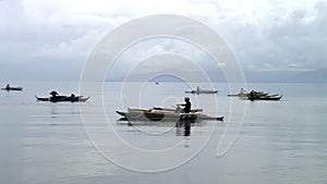 Fishermen catch fish in water of South China Sea in Republic of Philippines.
