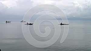 Fishermen catch fish in water of South China Sea in Republic of Philippines.