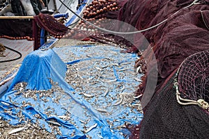 After fishermen cleaning nets and spread on the ground