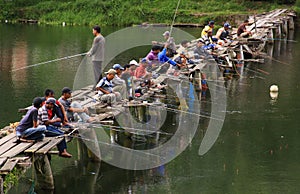 Fishermen crowd the bridge