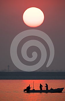 Fishermen fishing during sunrise, Bahrain