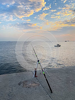 Fishermen fishing at sunset on the shores of the Sea of Marmara in Istanbul Turkey
