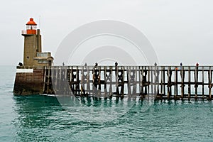 Fishermen on a high wooden pier