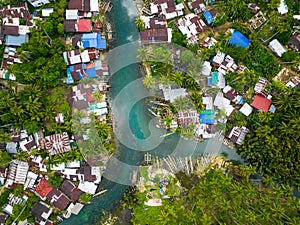 Fishermen Houses and Cold Spring in Surigao del Sur. Philippines. photo