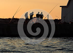 Fishermen On Ilha Deserta Algarve Portugal