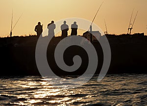 Fishermen On Ilha Deserta Algarve Portugal