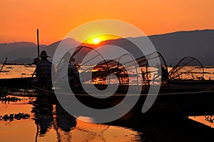 Fishermen in Inle lakes sunset.