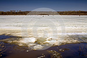 fishermen on the last ice on the river