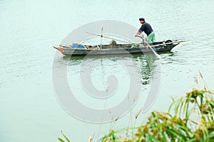 Fishermen on little boat