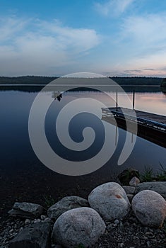 Fishermen Move Onto Lake in Early Morning Light