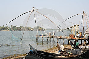 Fishermen operate a Chinese fishing net